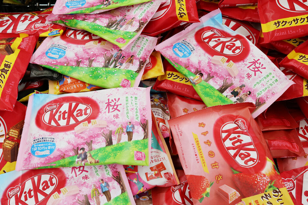 CHIBA, JAPAN - March 5, 2021: Bags of Kitkats including special cherry blossom (sakura) flavour in a supermarket.